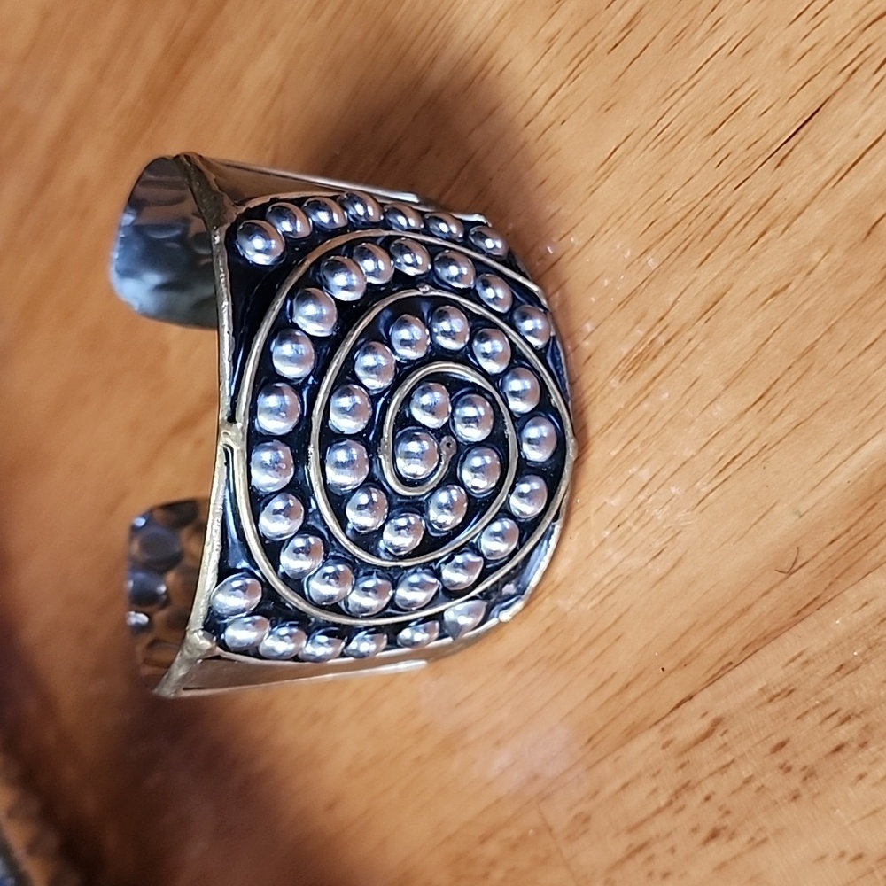 Women's beautiful artistic hammered metal two toned silver and gold tones.
